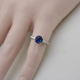 1950’s Sapphire and Tapered Baguette Diamond Platinum Ring Kirsten's Corner