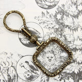 Georgian Pinchbeck Quizzing Glass with Floral Motif and Swivel Handle Pendant Kirsten's Corner 