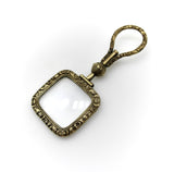Georgian Pinchbeck Quizzing Glass with Floral Motif and Swivel Handle Pendant Kirsten's Corner 