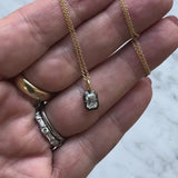 18K Gold 1/2 Carat Emerald Cut Diamond Collet Set & Black Rhodium Necklace
